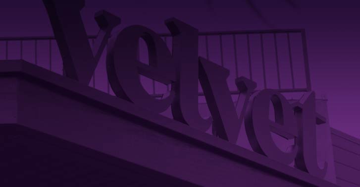 Duotone image of the exterior signage of Velvet Napa